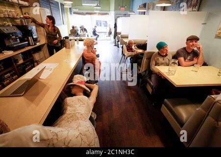 Vancouver, Canada. 15th June, 2020. Mannequins are used to block off seats at Roundel Cafe to give diners enough physical distance in Vancouver, British Columbia, Canada, on June 15, 2020. As restaurants were reopened under health safety protocols in Vancouver, the restaurant Roundel Cafe found its way by using mannequins instead of cordoned-off seats to help diners practice physical distancing. Credit: Liang Sen/Xinhua/Alamy Live News Stock Photo