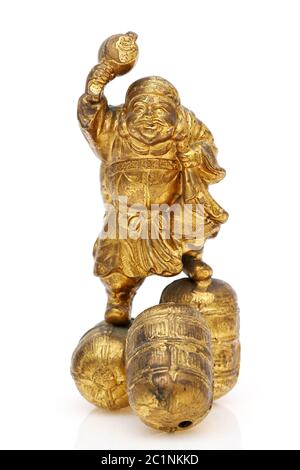 Statuette of Japanese daikoku god isolated on white background Stock Photo