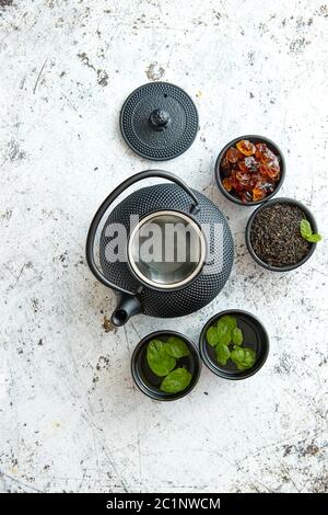 Traditional eastern metal teapot and iron cups Stock Photo