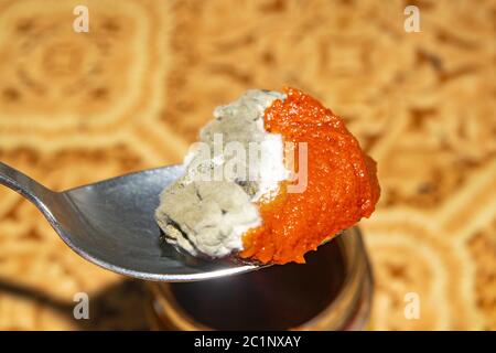 Mold growing on the tomato paste. Close up Stock Photo