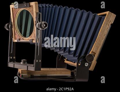 Intrepid 4X5 Mark IV Plywood Folding Field Film Camera on Plain Black Background for Easy Isolation and Cutout Stock Photo