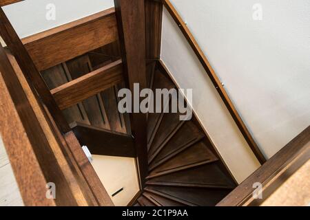 Modern brown oak wooden stairs in new renovated house interior Stock Photo