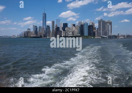 Skyline of downtown Manhattan New York during daytime as seen from a boat. Space for text on water. Stock Photo