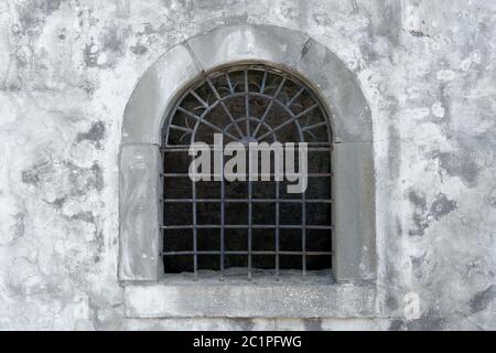 Semicircular lattice window in an old facade Stock Photo - Alamy