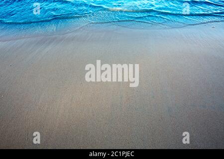 Wave of the sea on the sand beach. Travel background. Stock Photo