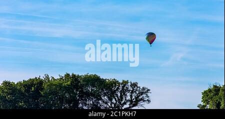 Hot air balloon over French fields - Dinan, France Stock Photo