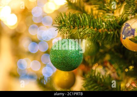 Decorated Christmas tree on blurred, sparkling and fairy background Stock Photo