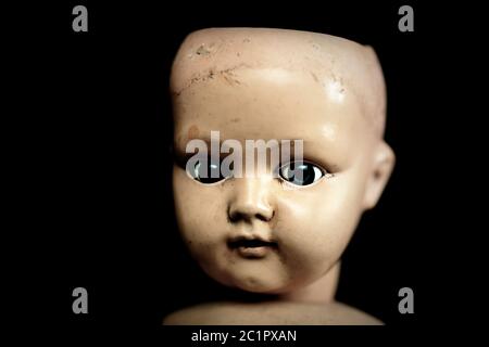 Creepy doll in the dark Stock Photo