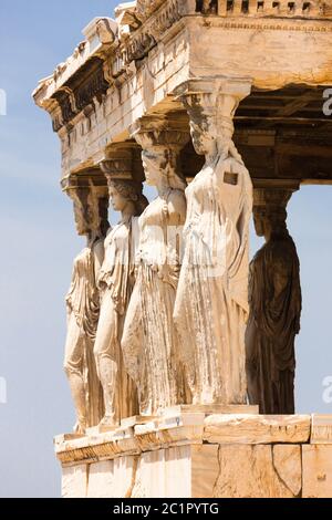 Ancient Greek temple with Ionic columns bathed in golden sunlight at ...