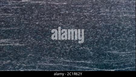 Texture and Seamless background of black granite stone. Stock Photo