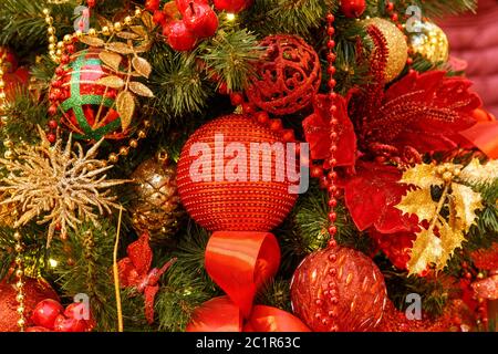 Traditional christmas or new year decorated fir tree with red baubles Stock Photo