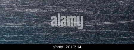 Texture and Seamless background of black granite stone. Stock Photo