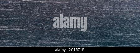 Texture and Seamless background of black granite stone. Stock Photo