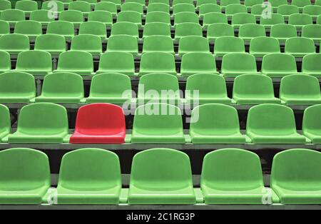 Empty seats in a stadium with one special Stock Photo