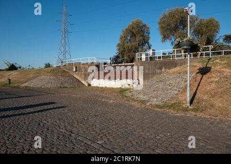 Old lock gate of Doel in Belgium reinforced with sandbags against flooding Stock Photo