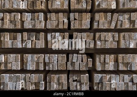 Front side of a stack of wooden slats, arranged like in a shelf Stock Photo