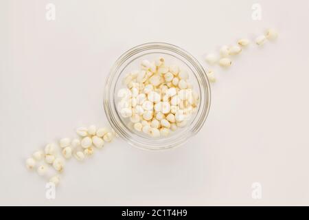 Dry lotus seeds from above on white. Stock Photo