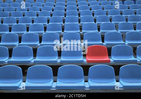 Empty seats in a stadium with one special Stock Photo