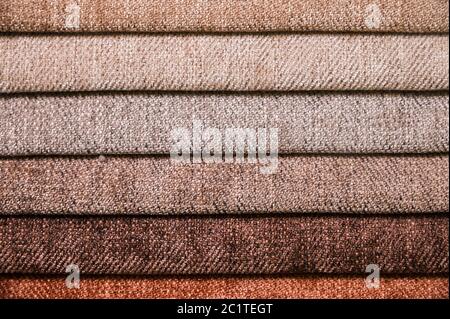 Colorful and bright fabric samples of furniture and clothing upholstery. Close-up of a palette of textile abstract stripes of di Stock Photo