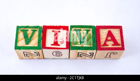 The term viva displayed visually on a clear background using colorful wooden blocks image with copy space in horizontal format Stock Photo