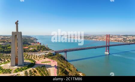 Aerial bridge on April 25th, Lisbon, Portugal. Statue of jesus christ lisbon. Close-up.