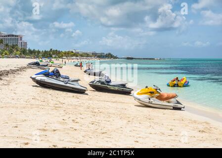 Nassau, Bahamas - May 3, 2019: Jet skis (water scooter, personal watercraft) on the Goodman's  beach. Goodman's Bay is a public beach in the east of C Stock Photo