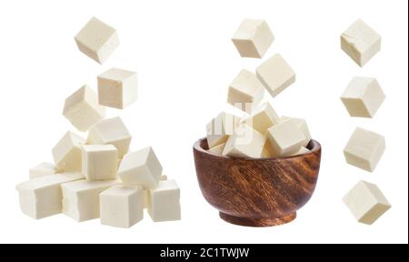 Feta isolated. Falling pieces of white cheese Stock Photo