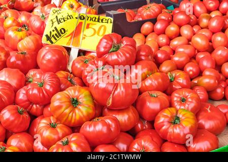 Beef tomatoes for sale at a market Stock Photo