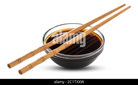 Soy sauce and chopsticks isolated on white Stock Photo