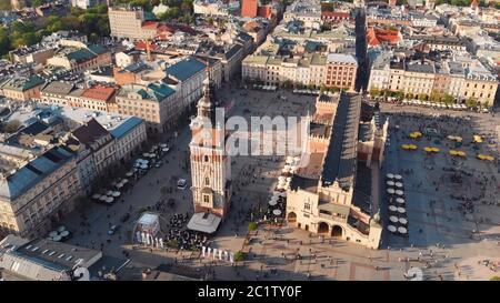 Urban block Main Square, with Town Hall Tower, in Krakow, drone shot. 