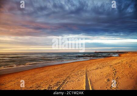 Beach in Mrzezyno at scenic sunset, Poland. Stock Photo