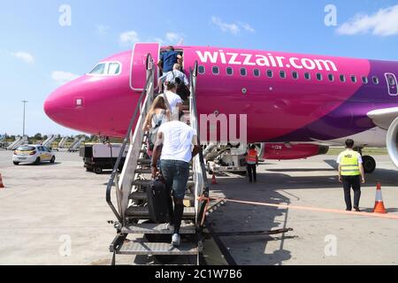 KATOWICE, POLAND - AUGUST 22, 2018: Passengers board low cost airline Wizz Air Airbus A320 aircraft at Katowice Airport in Poland. Katowice is the 4th Stock Photo