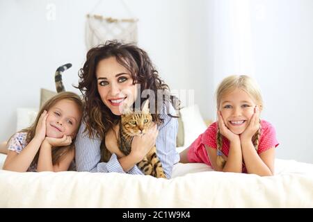 Happy family at home interior with the cat Stock Photo