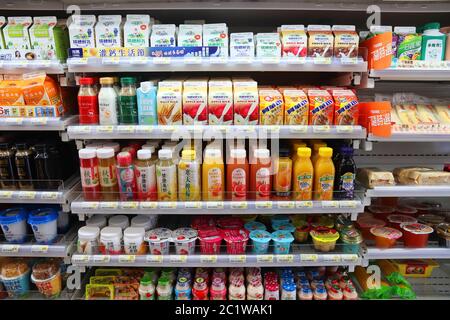 KEELUNG, TAIWAN - NOVEMBER 24, 2018: Milk drinks, yoghurts and juices selection at a convenience store refrigerator in Keelung, Taiwan. Stock Photo