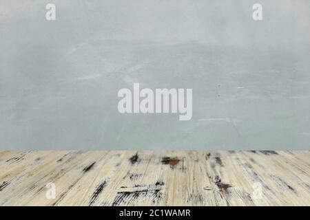 washed wood table with concrete texture background. Stock Photo