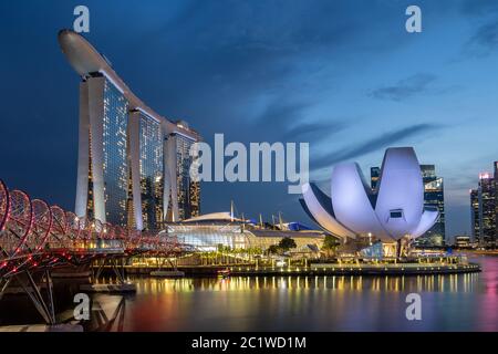 sunsent and night shots of the Marina Bay in Singapore Stock Photo