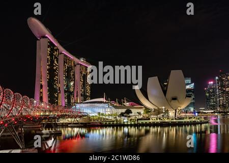 sunsent and night shots of the Marina Bay in Singapore Stock Photo