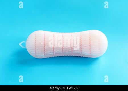 Brush for cleaning clothes on blue background. Stock Photo