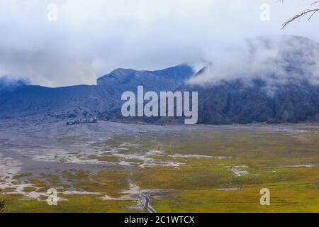 Eruption of Bromo Mountain, white smoke rises from the caldera of Bromo Mount, Indonesia Stock Photo