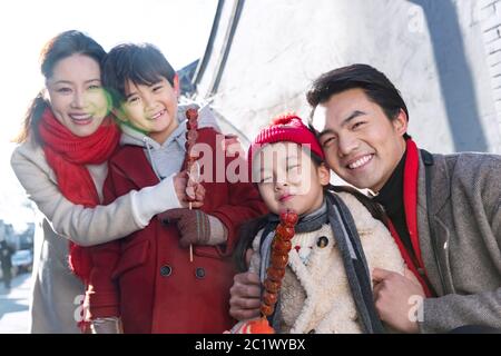 Happy family with sugar-coated berry shopping Stock Photo