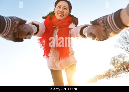 Happy young couple in the skating rink Stock Photo