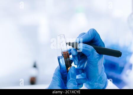 close up. scientist marks the tubes with tests. Stock Photo