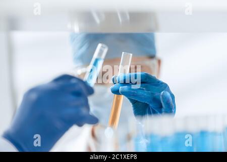 close up. scientists compare liquids in test tubes. Stock Photo