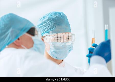 close up. scientists compare liquids in test tubes. Stock Photo