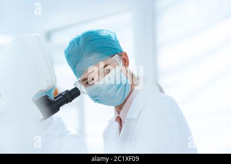 female scientist conducts research in a medical laboratory. Stock Photo