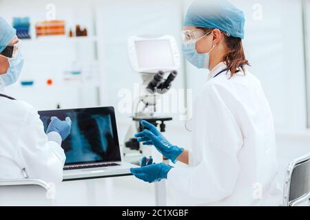 close up. attending doctors discussing x-rays in the laboratory. Stock Photo