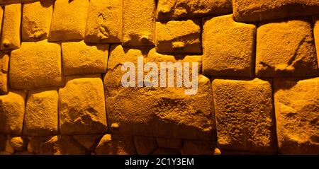 View to Twelve-angled stone aka Hatun Rumiyoc as a part of a wall of the palace of the Archbishop of Cuzco, Peru Stock Photo