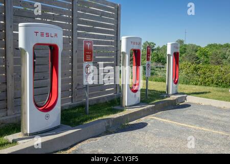 Tesla Electric Vehicle Charging Station Supercharging Network In Woodstock Ontario Canada Stock Photo