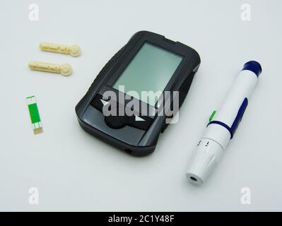 Set of glucose meter with diabetes indicator strips for blood glucose testing Stock Photo