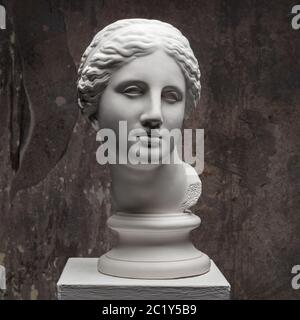 White marble head of young woman. Statue art sculpture of stone face. Ancient beautiful woman monument Stock Photo